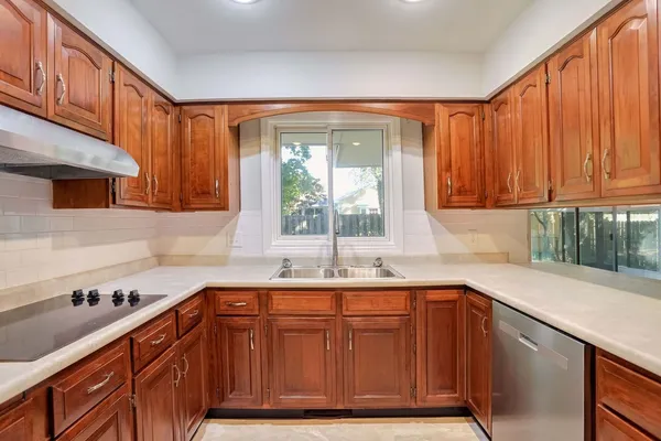 a kitchen with a sink and a window