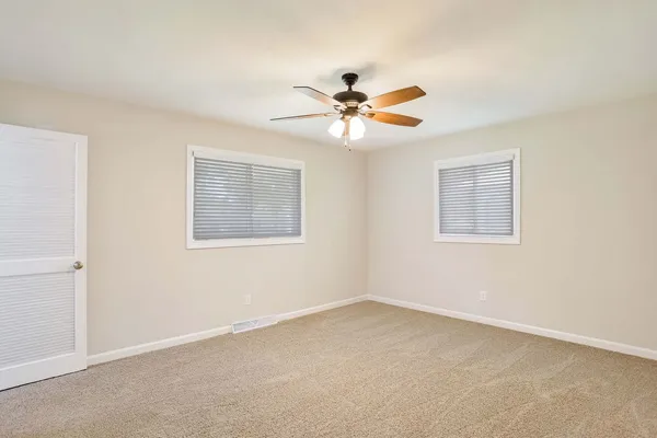 a view of a big room with carpet