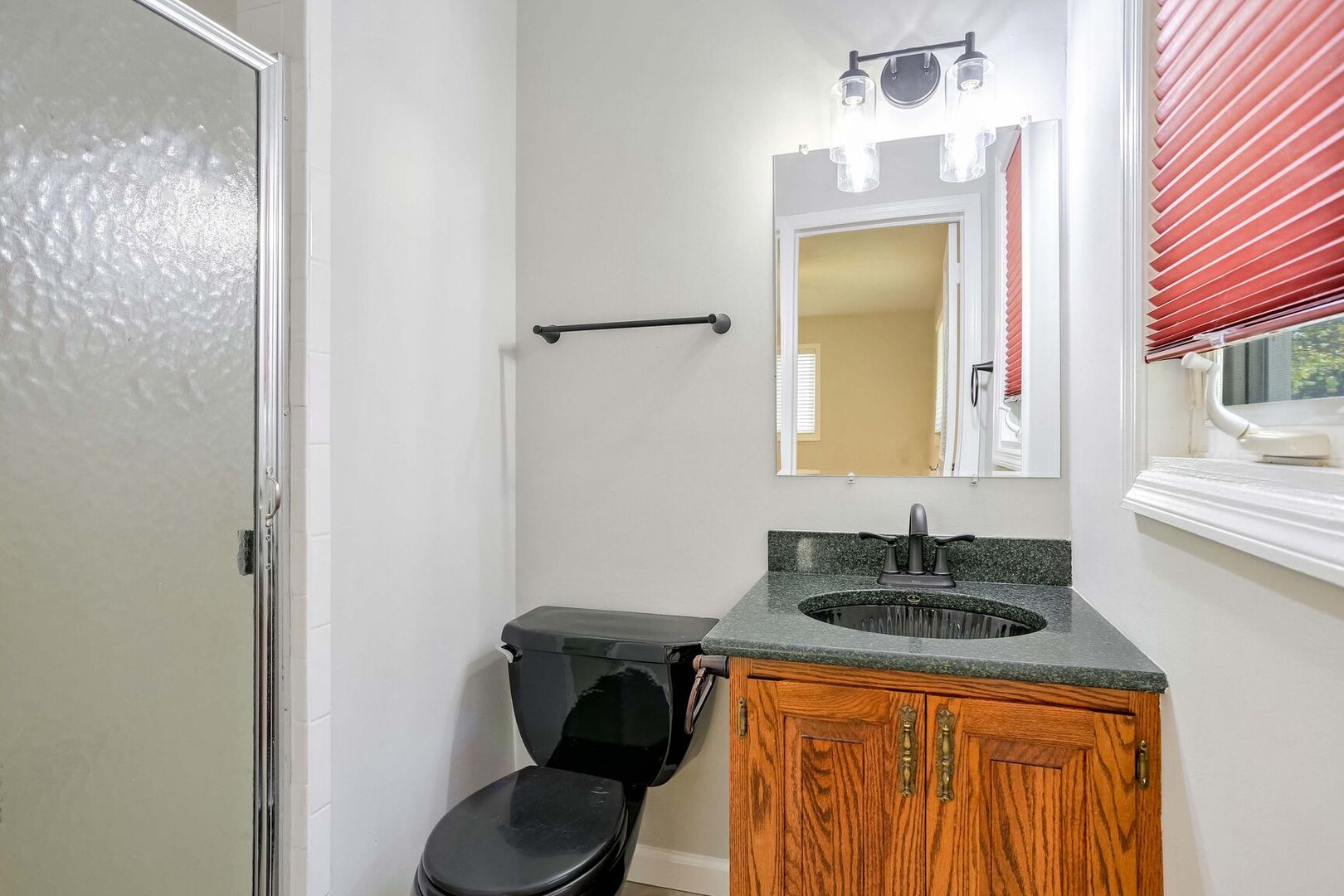 1716 Georgetown Drive Champaign, IL 61821 - Photo 20 of 36 a bathroom with a sink a toilet and mirror