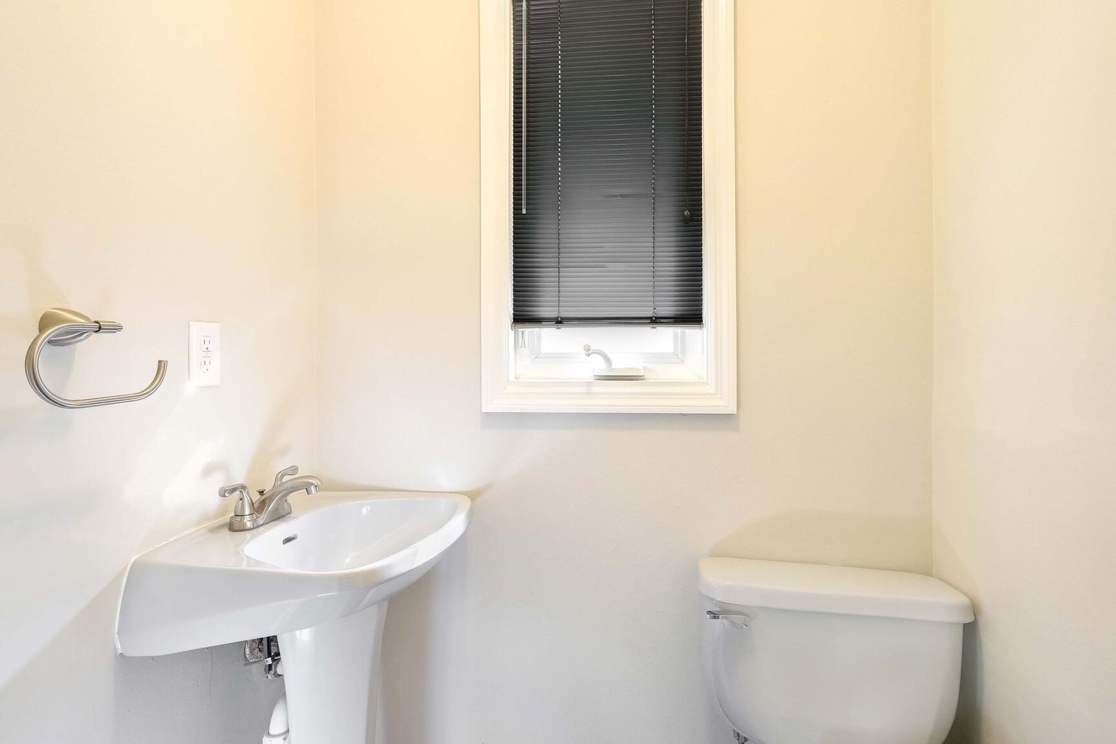 1716 Georgetown Drive Champaign, IL 61821 - Photo 26 of 36 a bathroom with a sink a toilet and a mirror