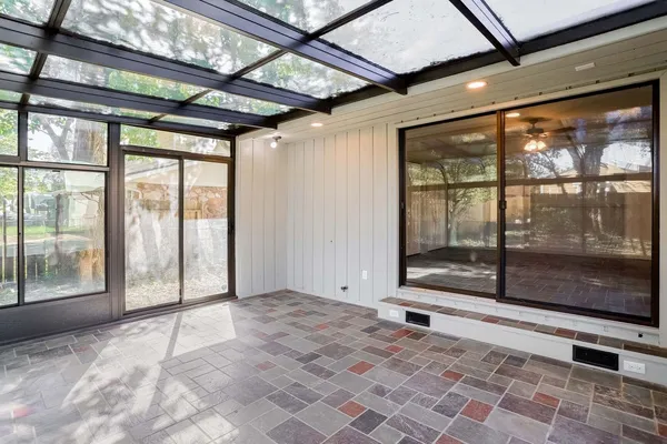 a view of an empty room with a sliding door