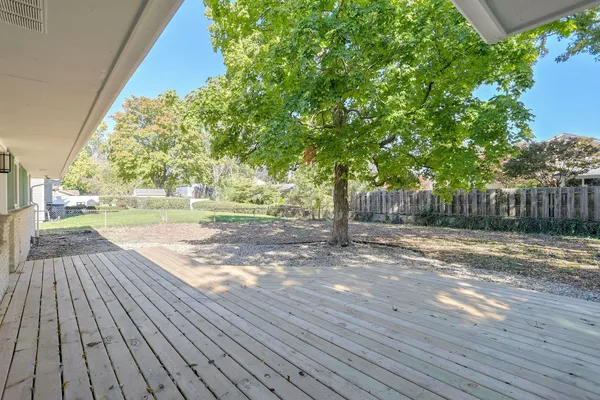 a view of a yard with wooden floor