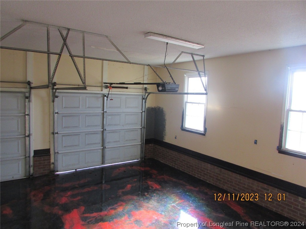 8850 Timothy Road Dunn, NC 28334 - Photo 14 of 15 a view of a room with rack and wooden floor