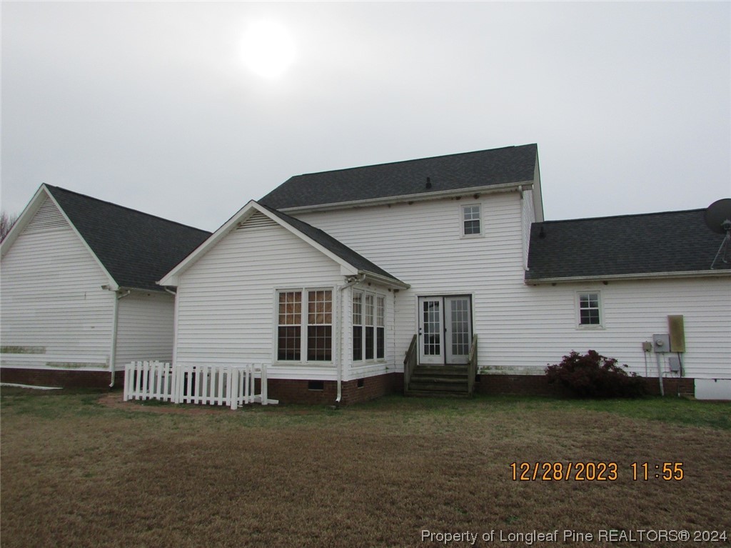 8850 Timothy Road Dunn, NC 28334 - Photo 2 of 15 a view of a house with a yard