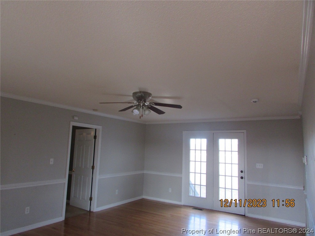 8850 Timothy Road Dunn, NC 28334 - Photo 4 of 15 wooden floor in an empty room with a window