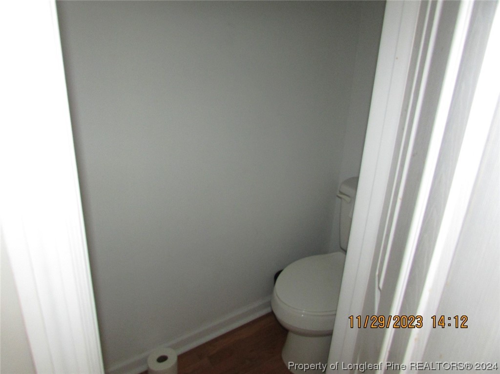 8850 Timothy Road Dunn, NC 28334 - Photo 9 of 15 a white toilet sitting next to a small window