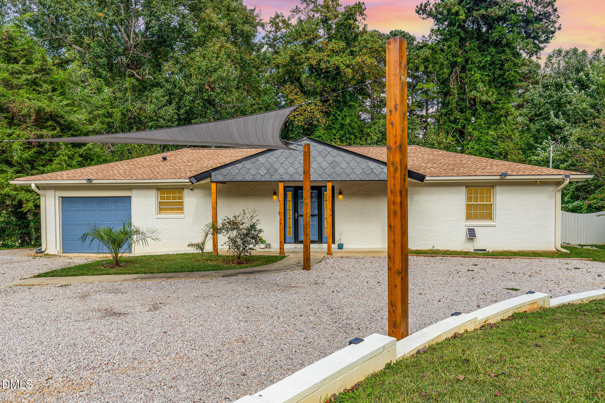 5333 Olive Road Raleigh, NC 27606 - Photo 1 of 21 a front view of a house with garden