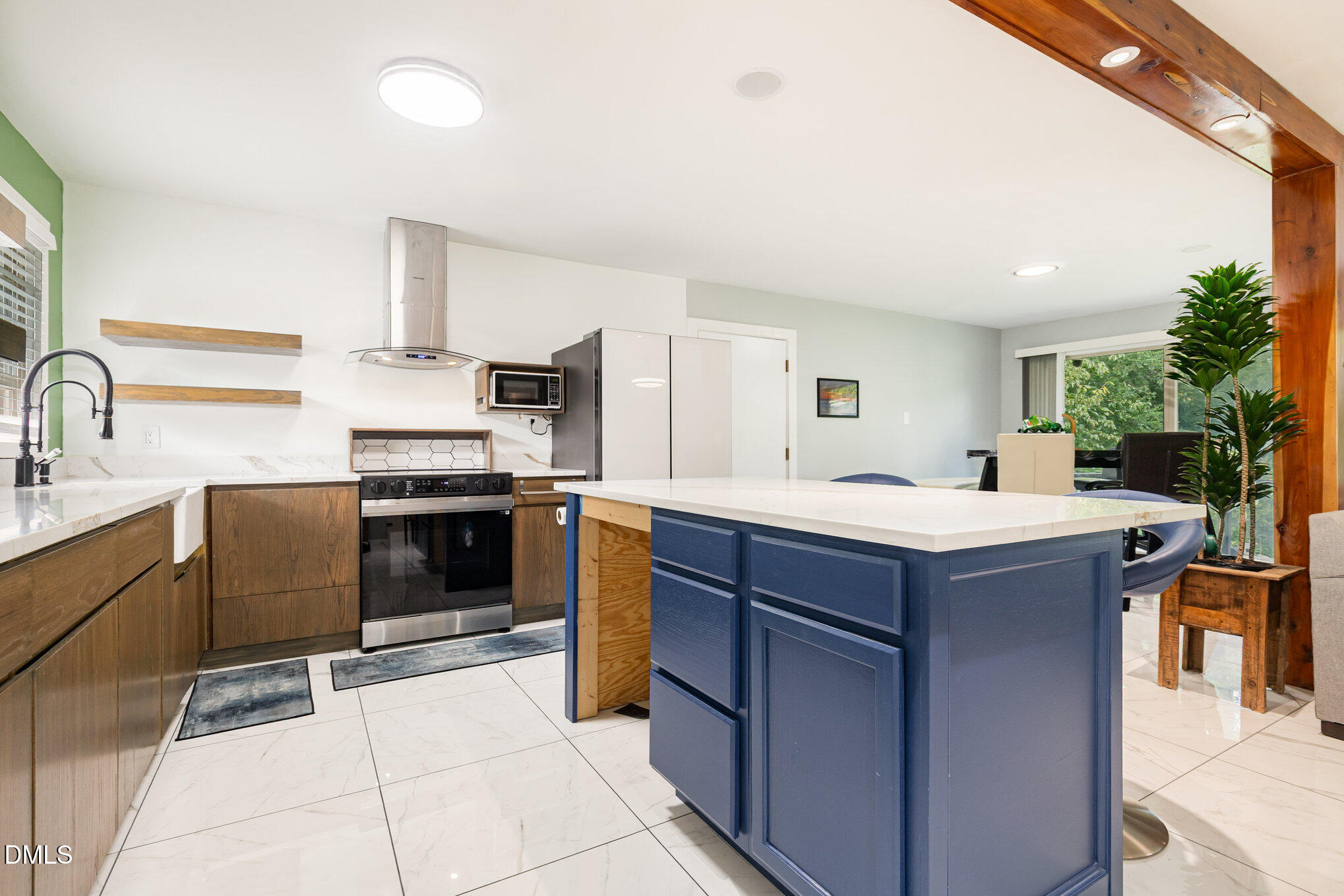 5333 Olive Road Raleigh, NC 27606 - Photo 12 of 21 a kitchen with a sink cabinets and stainless steel appliances