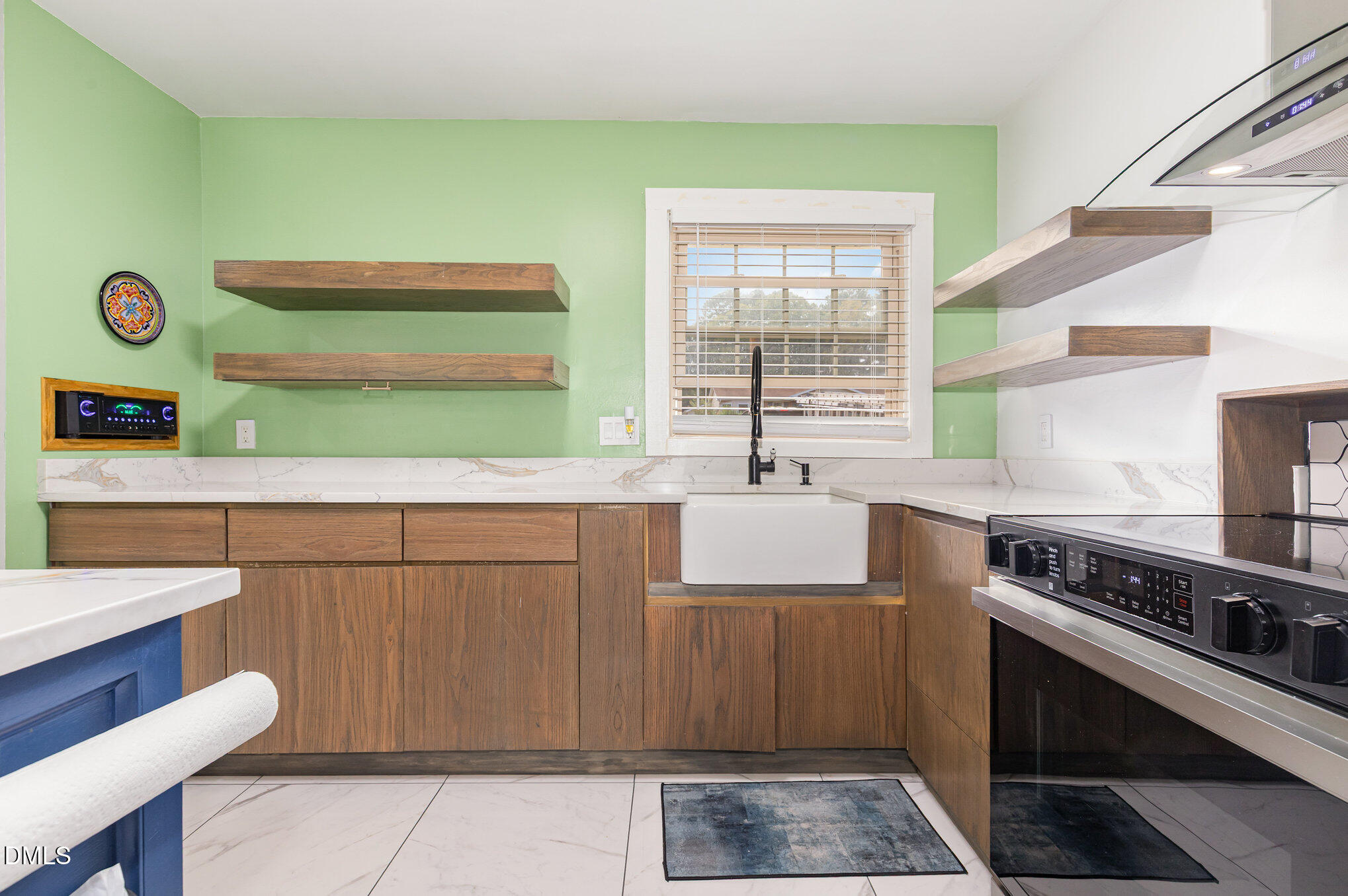 5333 Olive Road Raleigh, NC 27606 - Photo 13 of 21 a kitchen with stainless steel appliances cabinets and a table