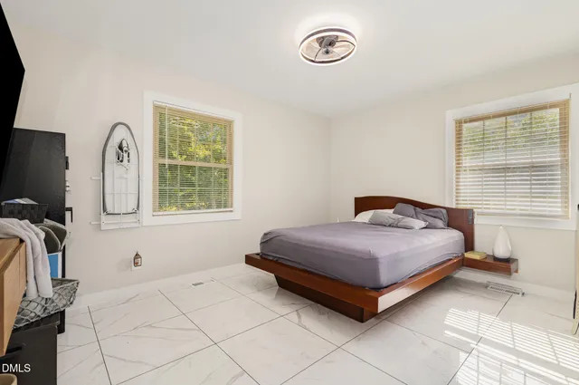 a kitchen with stainless steel appliances cabinets and a table