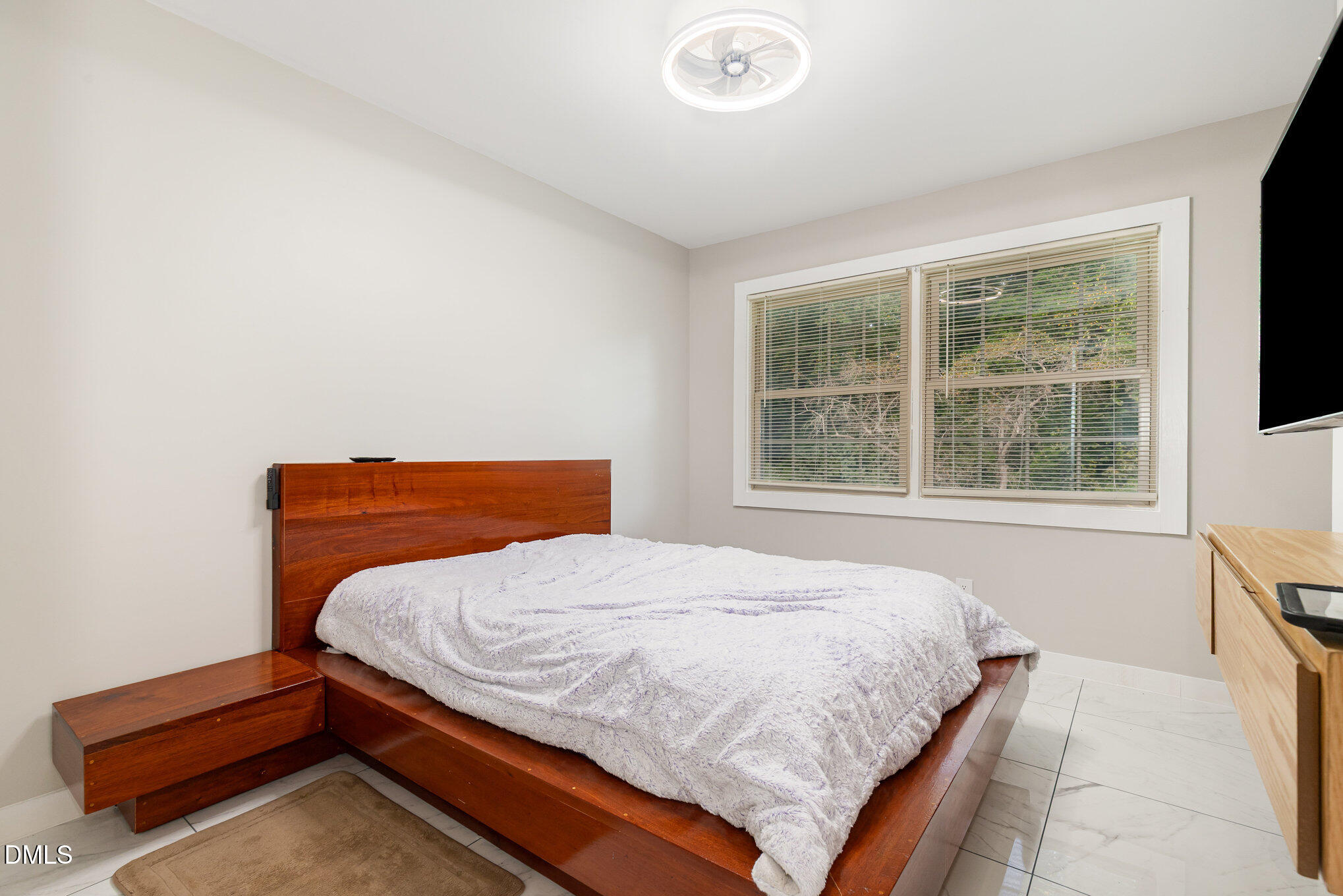 5333 Olive Road Raleigh, NC 27606 - Photo 17 of 21 a bedroom with a bed and windows