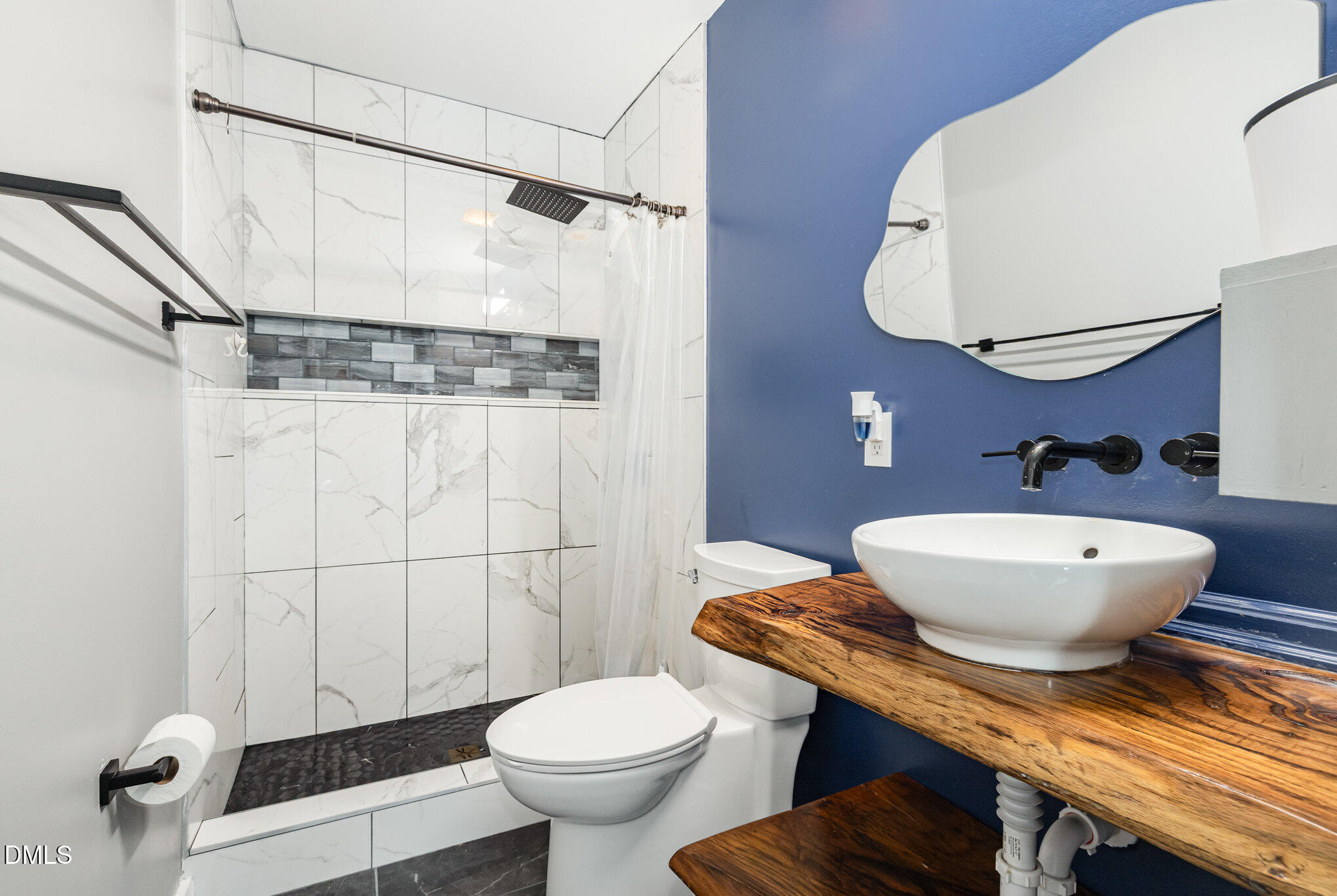 5333 Olive Road Raleigh, NC 27606 - Photo 18 of 21 a bathroom with a sink toilet and shower