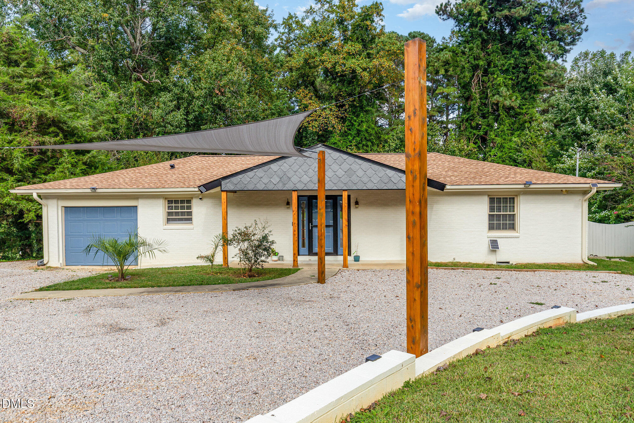 5333 Olive Road Raleigh, NC 27606 - Photo 2 of 21 a front view of a house with garden