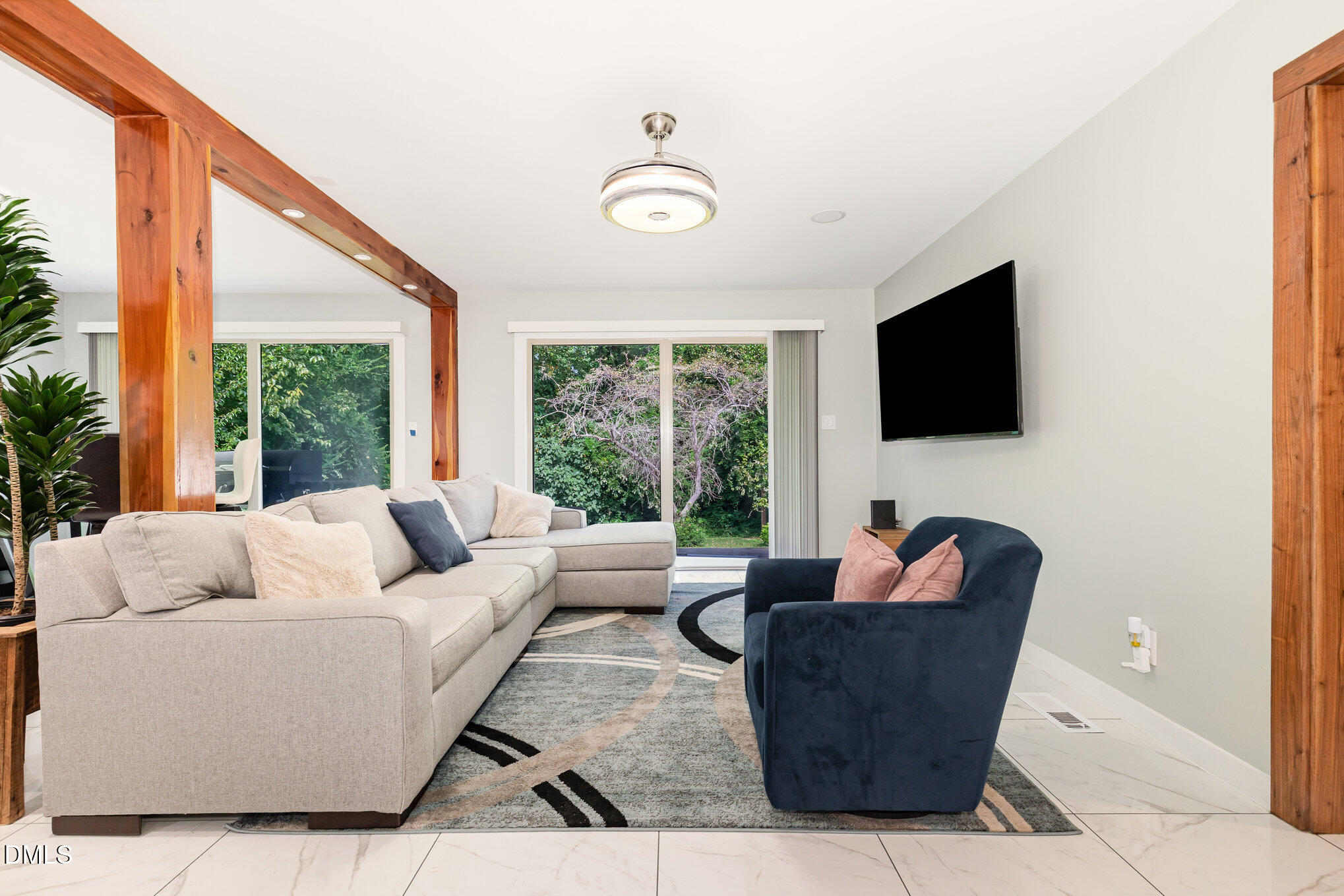 5333 Olive Road Raleigh, NC 27606 - Photo 5 of 21 a living room with furniture and a flat screen tv