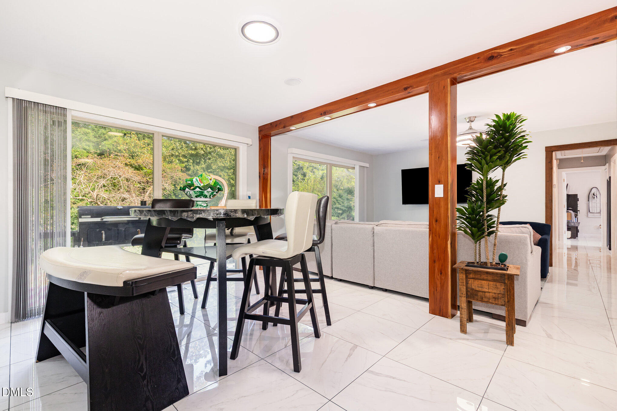 5333 Olive Road Raleigh, NC 27606 - Photo 8 of 21 a view of a dining room with furniture and a potted plant