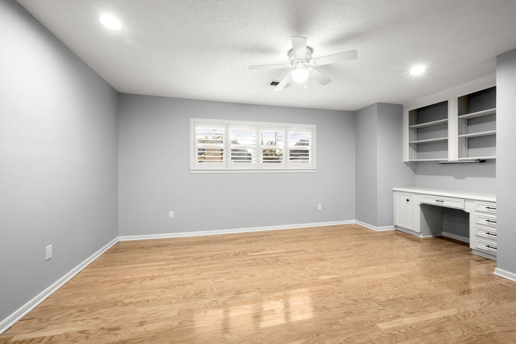 16111 Maplehurst Drive Spring, TX 77379 - Photo 22 of 30 a view of an empty room with a fireplace and a window