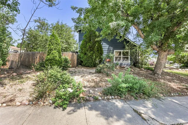 a backyard of a house with seating space