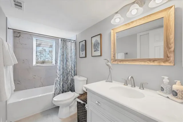 a view of a room with wooden floor and window