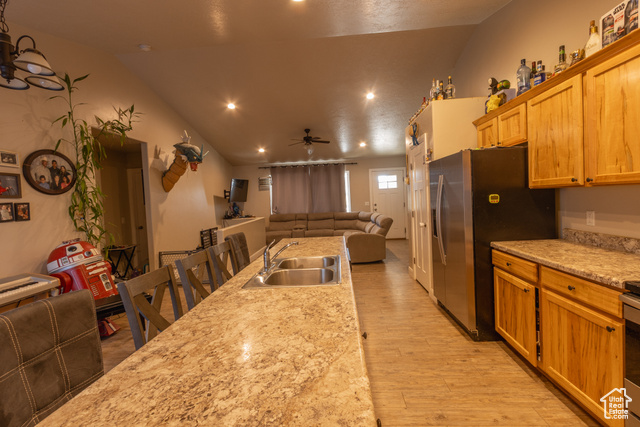 660 East 400 North Spring City, UT 84662 - Photo 16 of 16 Kitchen with open floor plan, stainless steel fridge, a sink, light wood finished floors, and ceiling fan
