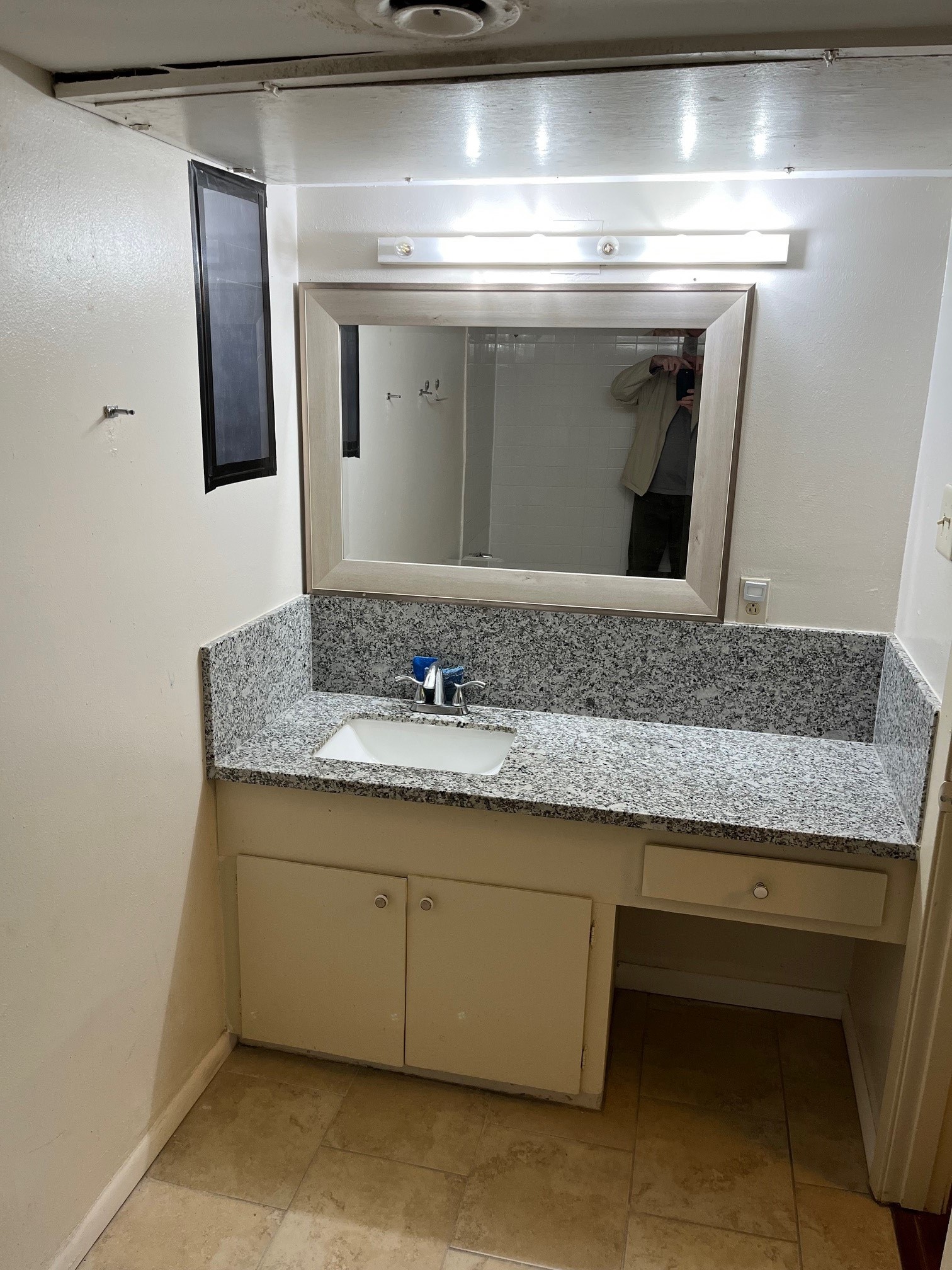 3938 West Alabama Street, Unit 12 Houston, TX 77027 - Photo 18 of 25 Full bathroom with granite vanity countertop, framed mirror & storage cabinetry.