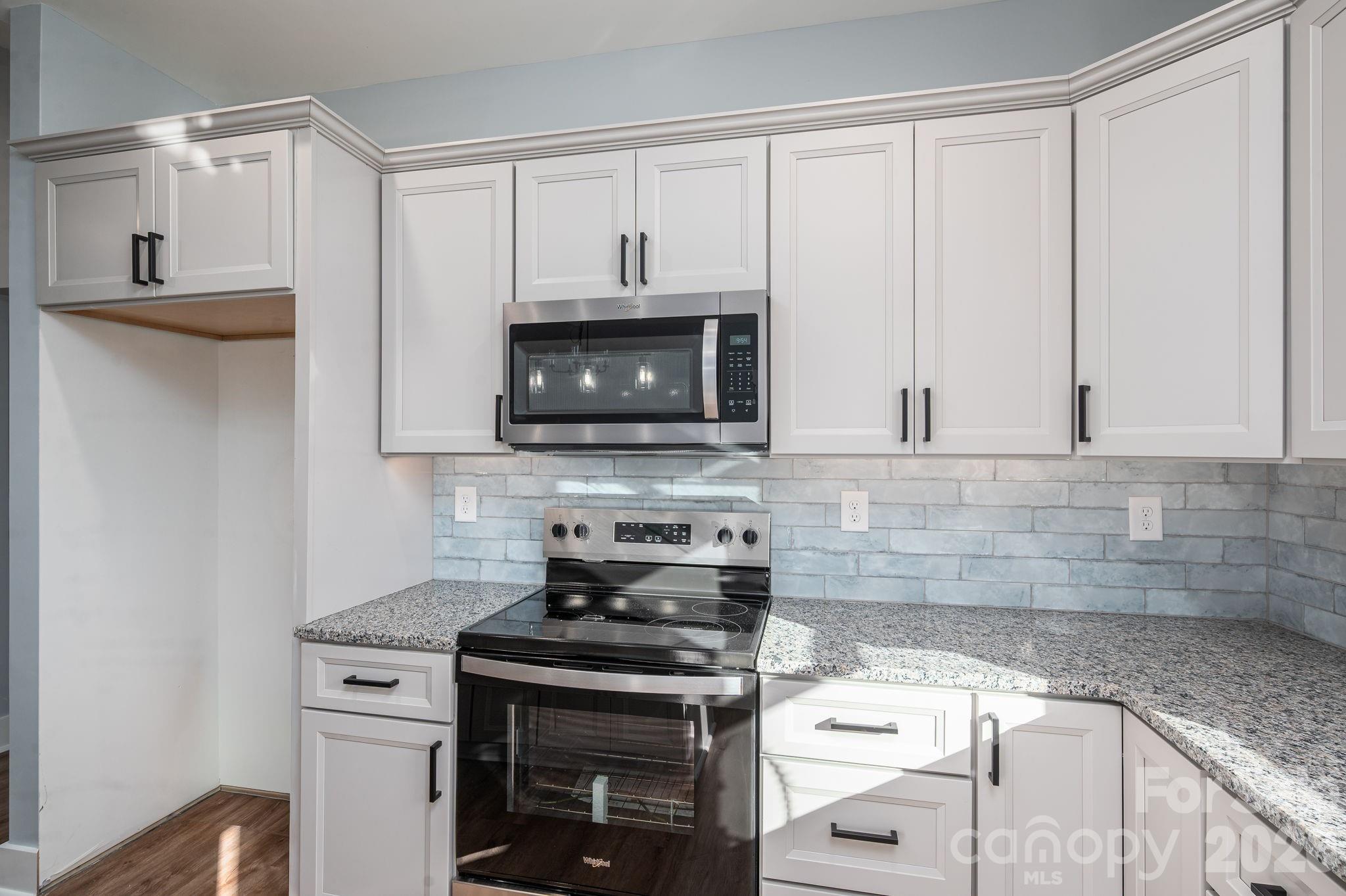 1161 13th Street Southwest Hickory, NC 28602 - Photo 13 of 27 a kitchen with appliances a sink and cabinets
