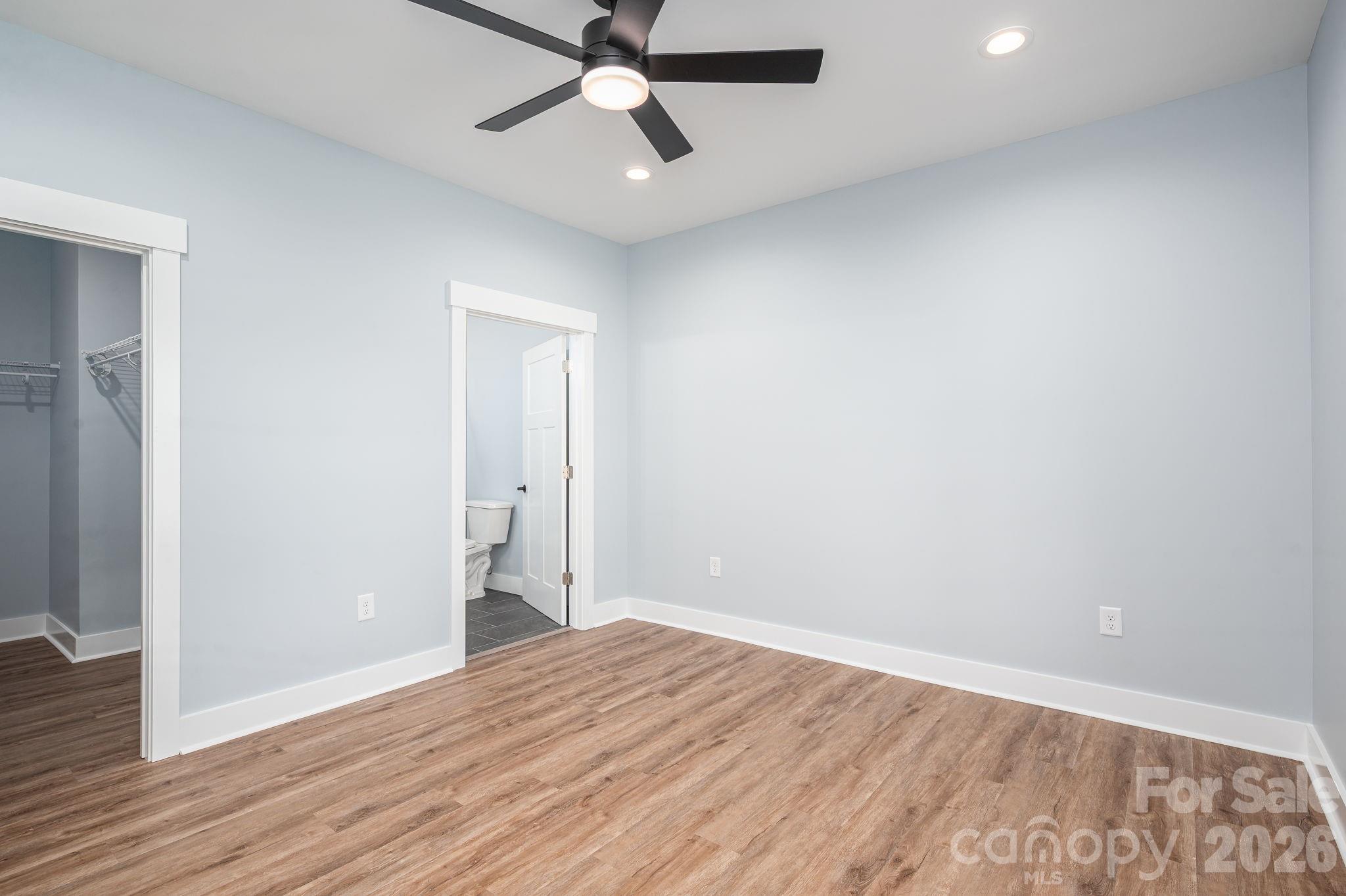 1161 13th Street Southwest Hickory, NC 28602 - Photo 15 of 27 wooden floor in an empty room with a window
