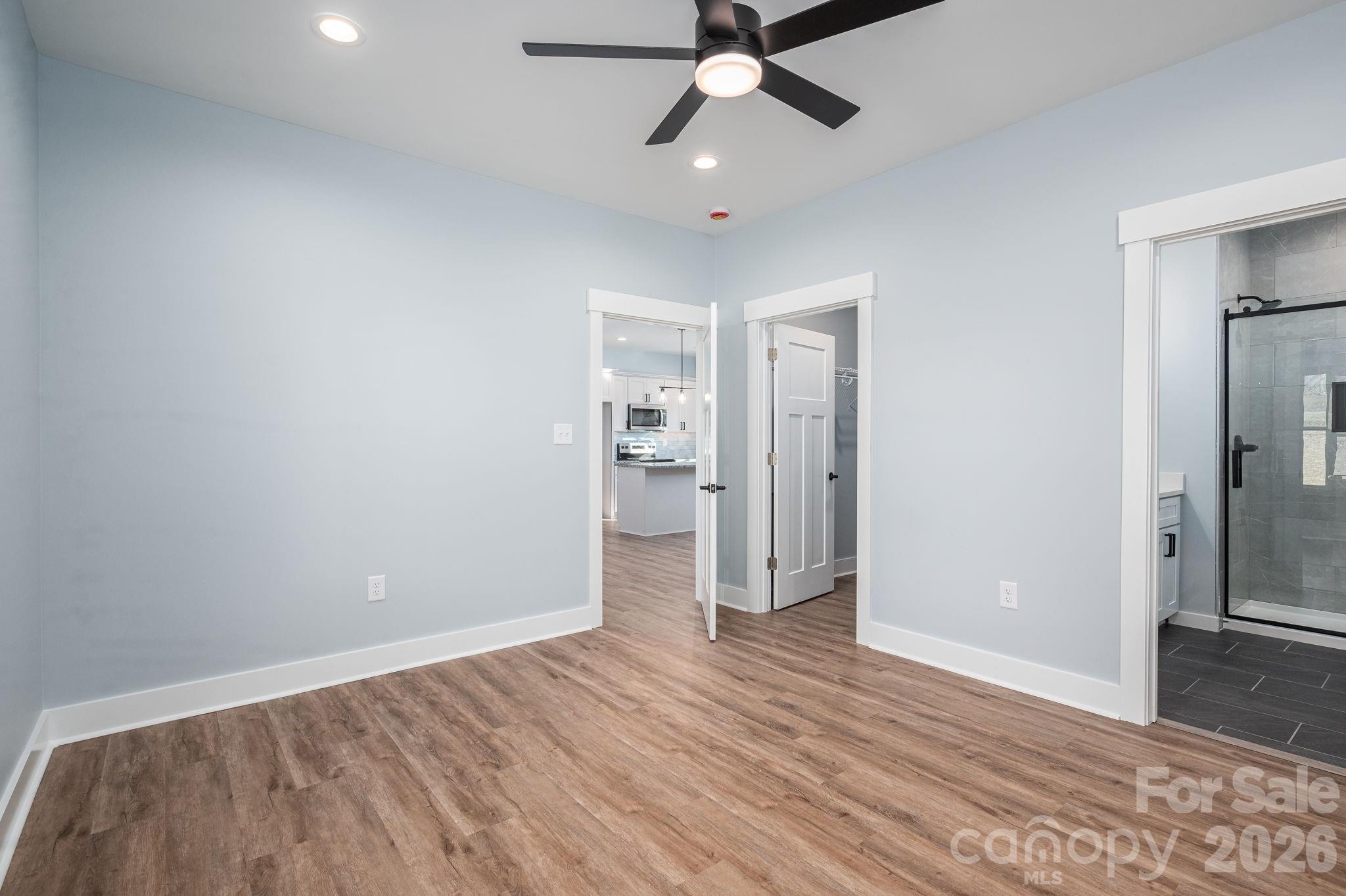 1161 13th Street Southwest Hickory, NC 28602 - Photo 16 of 27 wooden floor in an empty room with a bathroom