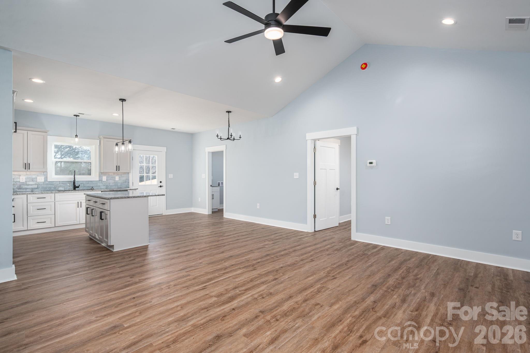 1161 13th Street Southwest Hickory, NC 28602 - Photo 6 of 27 a view of kitchen with cabinets and wooden floor