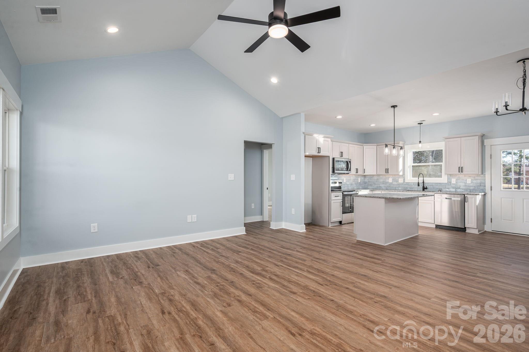1161 13th Street Southwest Hickory, NC 28602 - Photo 7 of 27 a view of kitchen with wooden floor and window