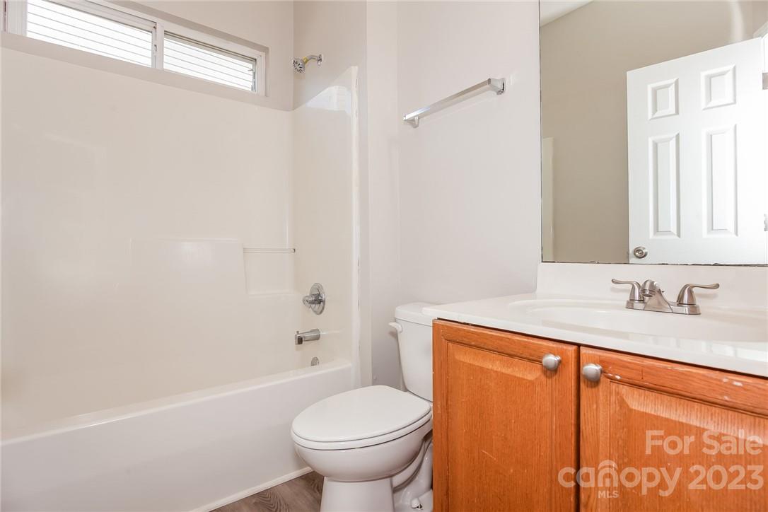 8215 Pozzi Road Charlotte, NC 28216 - Photo 12 of 15 a bathroom with a sink toilet and shower