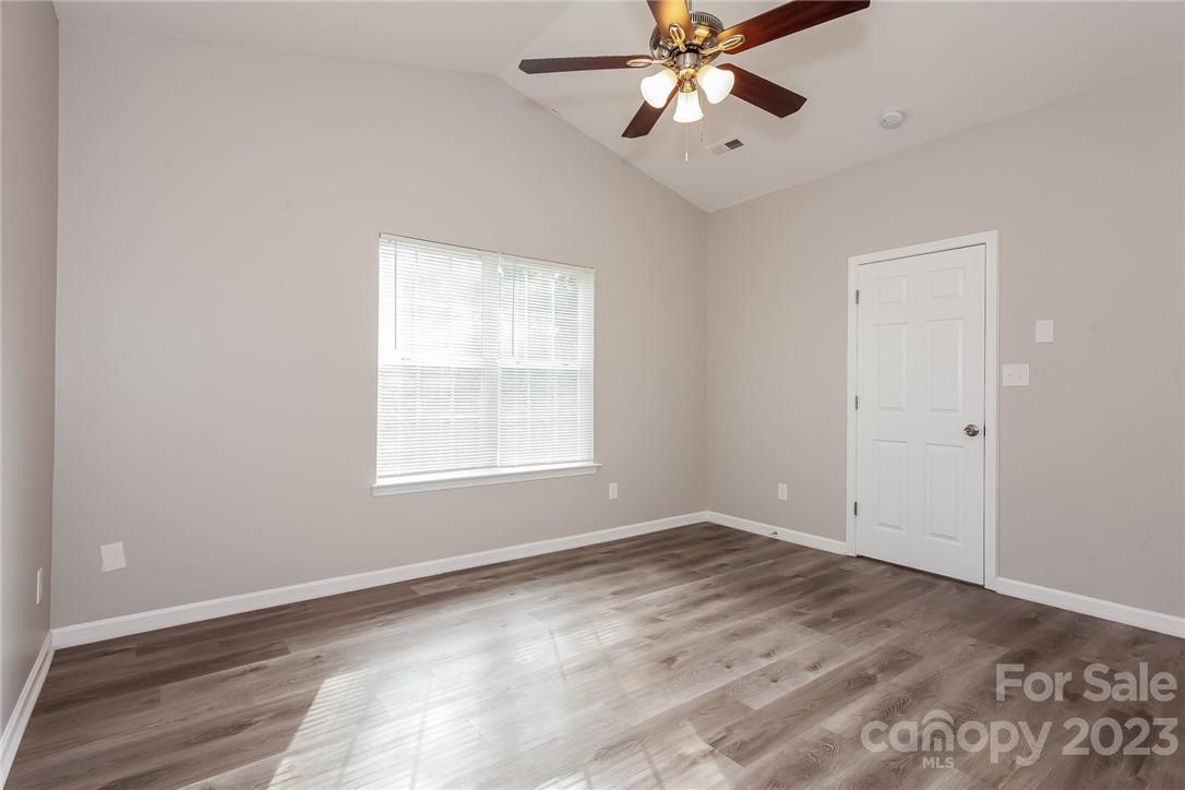 8215 Pozzi Road Charlotte, NC 28216 - Photo 6 of 15 a view of an empty room with a window