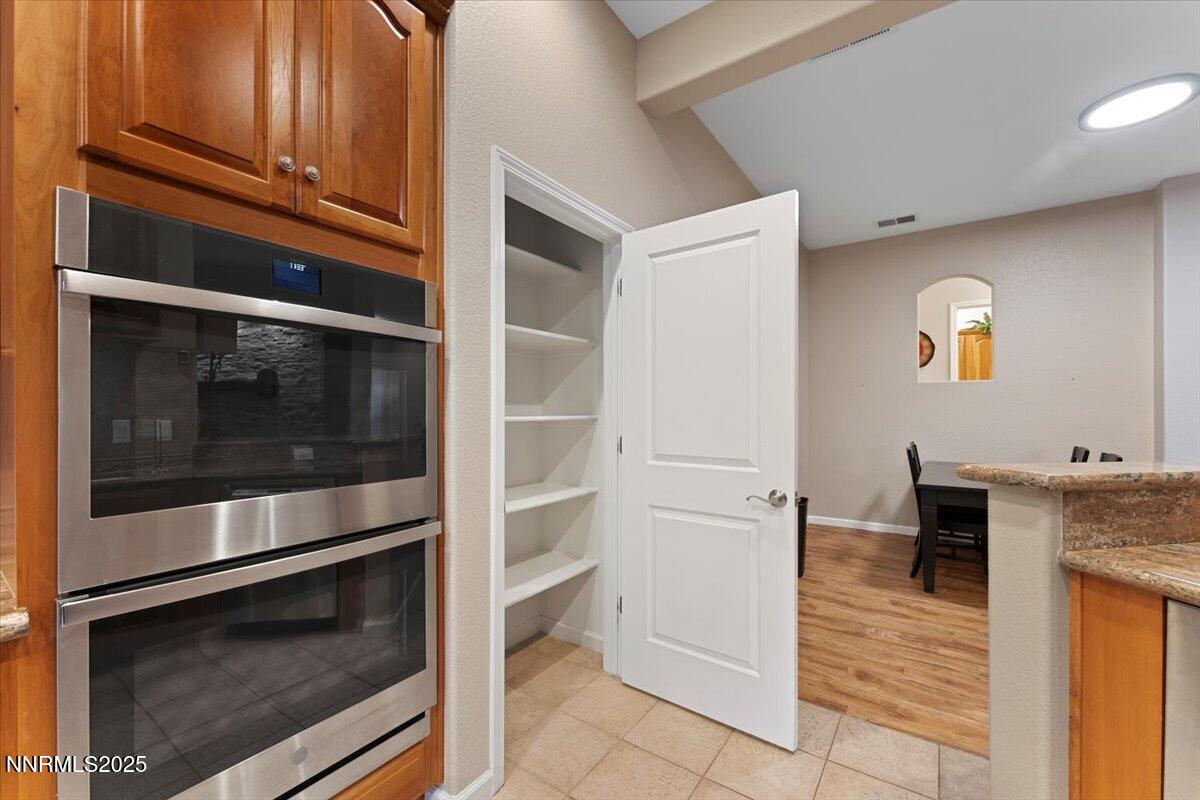 9900 Wilbur May Parkway, Unit 602 Reno, NV 89521 - Photo 14 of 32 a kitchen with a stove and a microwave