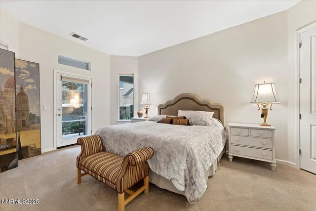 a bedroom with a bed and a mirror