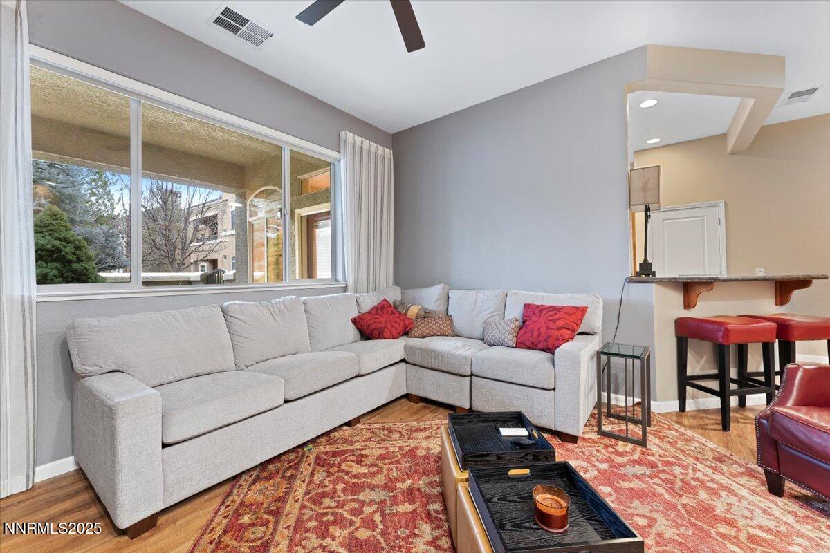 9900 Wilbur May Parkway, Unit 602 Reno, NV 89521 - Photo 8 of 32 a living room with furniture and a rug