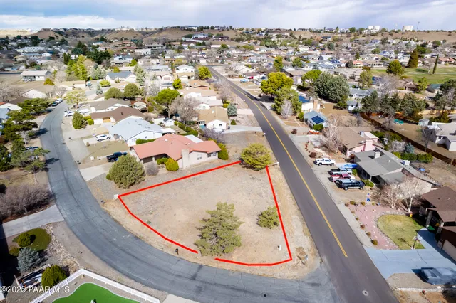 an aerial view of a residential houses with outdoor space