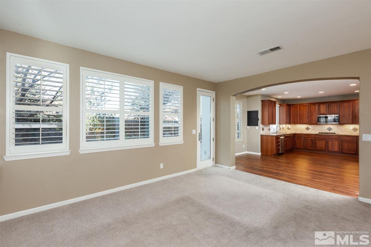 14005 Traveler Court Reno, NV 89521 - Photo 11 of 25 a view of an empty room with kitchen and window