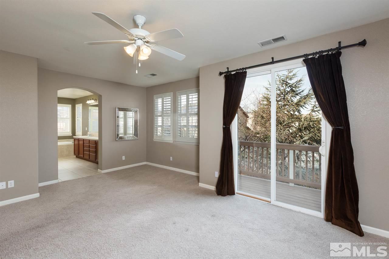 14005 Traveler Court Reno, NV 89521 - Photo 14 of 25 wooden floor in an empty room with a window