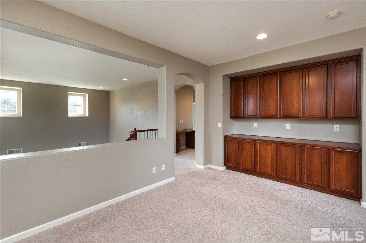 14005 Traveler Court Reno, NV 89521 - Photo 17 of 25 a view of an empty room with closet and wooden floor