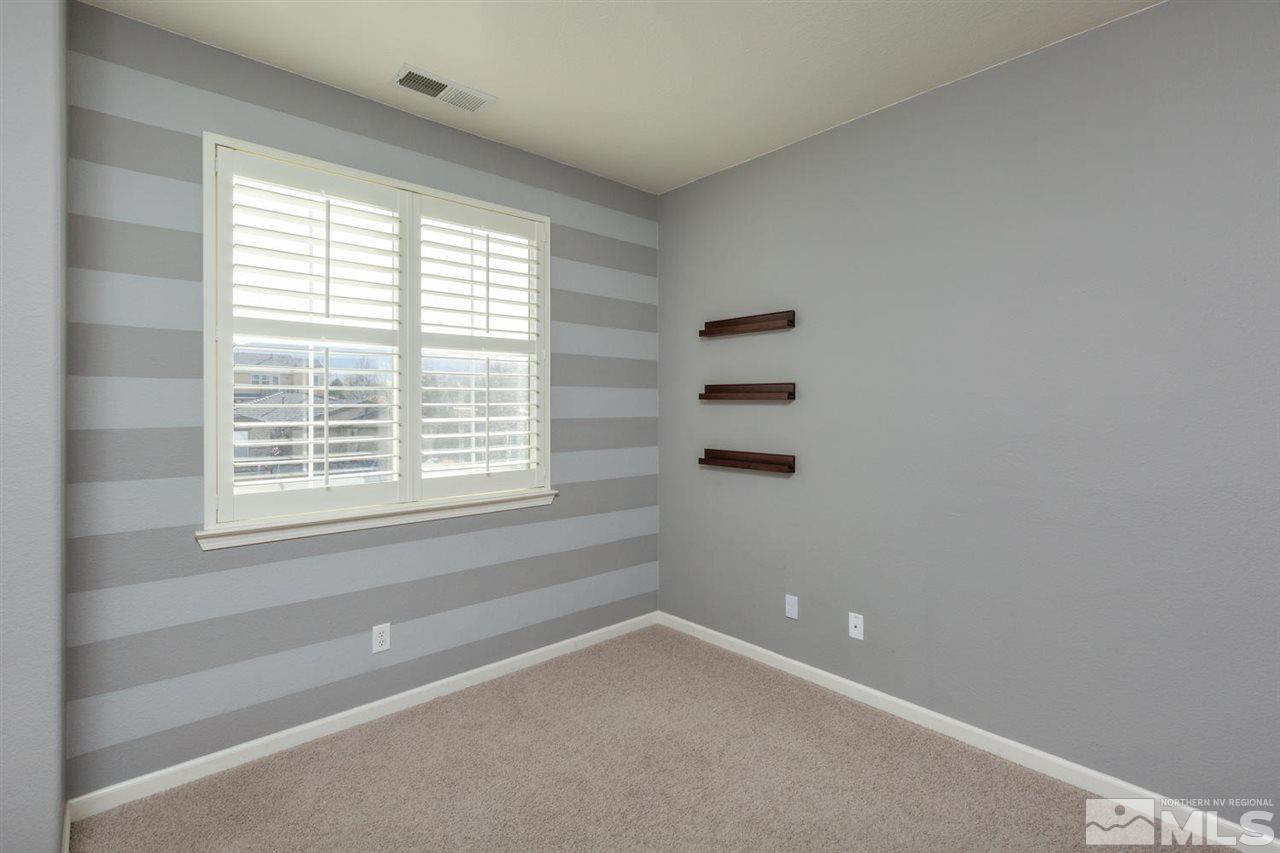 14005 Traveler Court Reno, NV 89521 - Photo 18 of 25 a view of an empty room with a window
