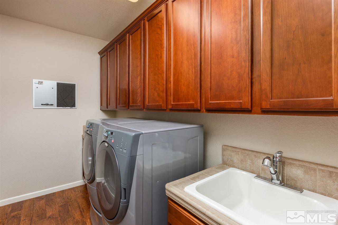 14005 Traveler Court Reno, NV 89521 - Photo 20 of 25 a bathroom with a sink and a washer dryer