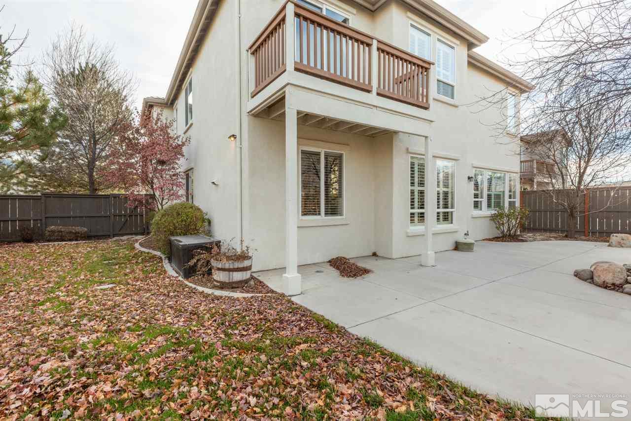 14005 Traveler Court Reno, NV 89521 - Photo 21 of 25 a front view of a house with a yard