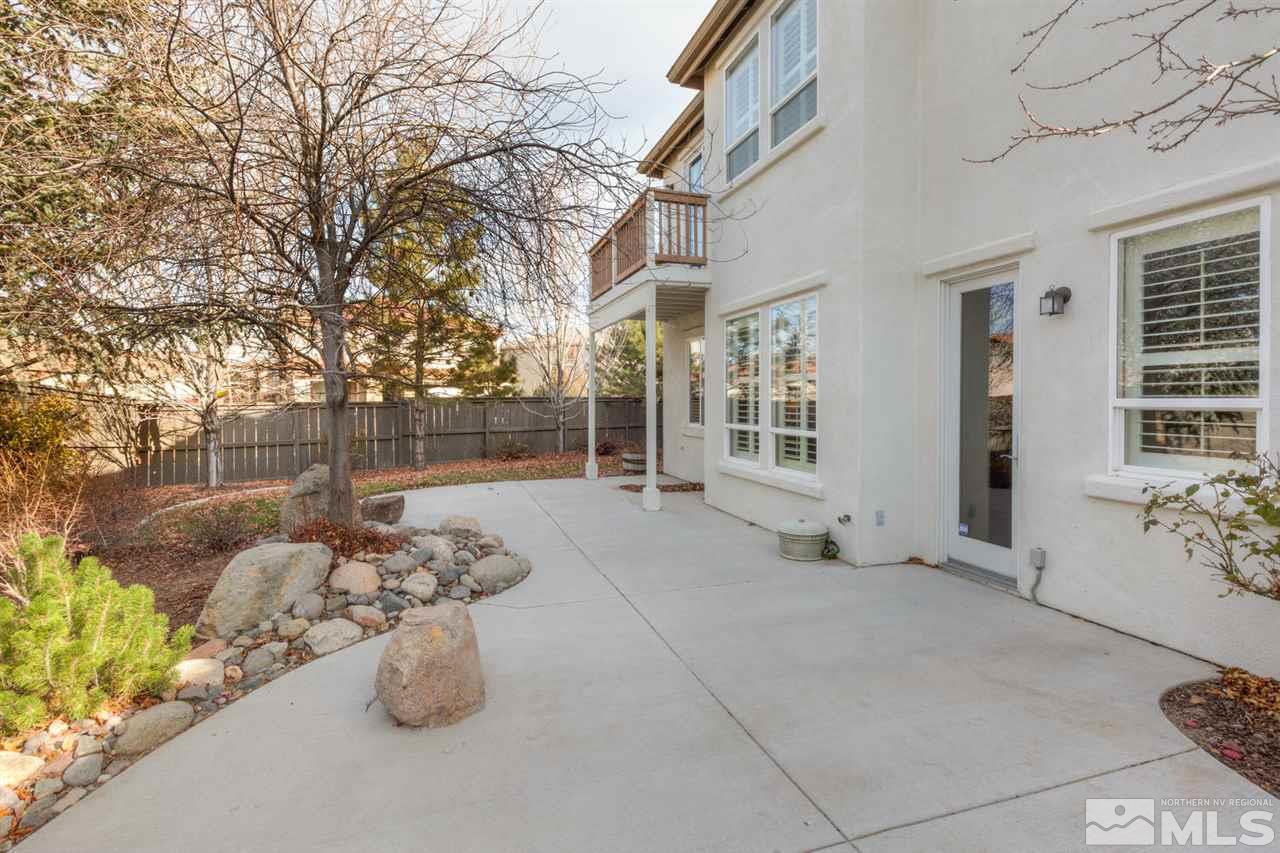 14005 Traveler Court Reno, NV 89521 - Photo 22 of 25 a view of a patio with table and chairs and potted plants
