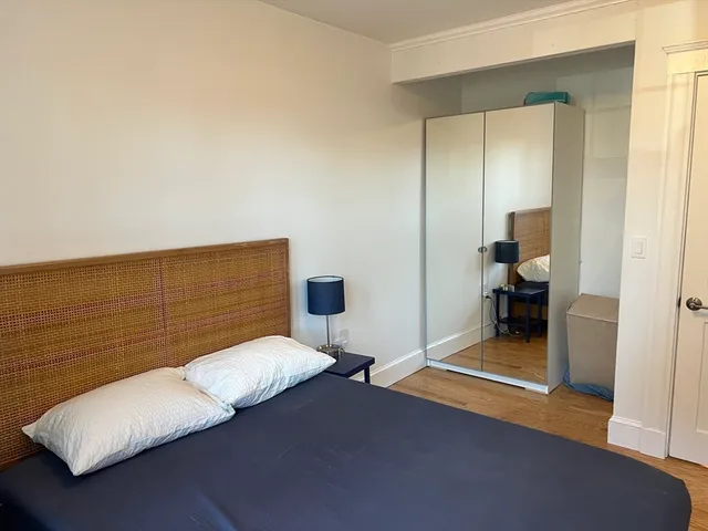 a bedroom with a bed and a view of bedroom