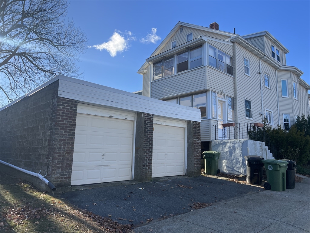 52 Ralph Street, Unit 52 Watertown, MA 02472 - Photo 17 of 17 a front view of a house with a yard