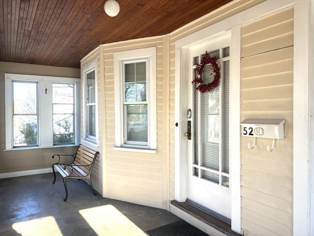 52 Ralph Street, Unit 52 Watertown, MA 02472 - Photo 2 of 17 a view of a livingroom with furniture and windows