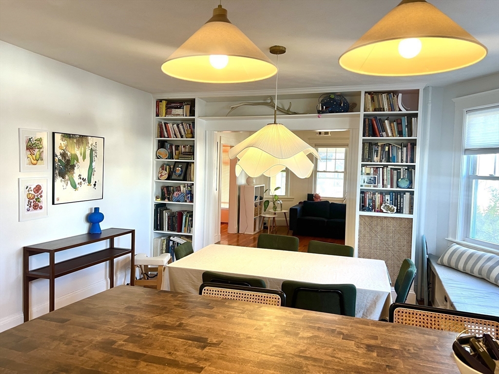 52 Ralph Street, Unit 52 Watertown, MA 02472 - Photo 5 of 17 a bedroom with a bed and a chandelier