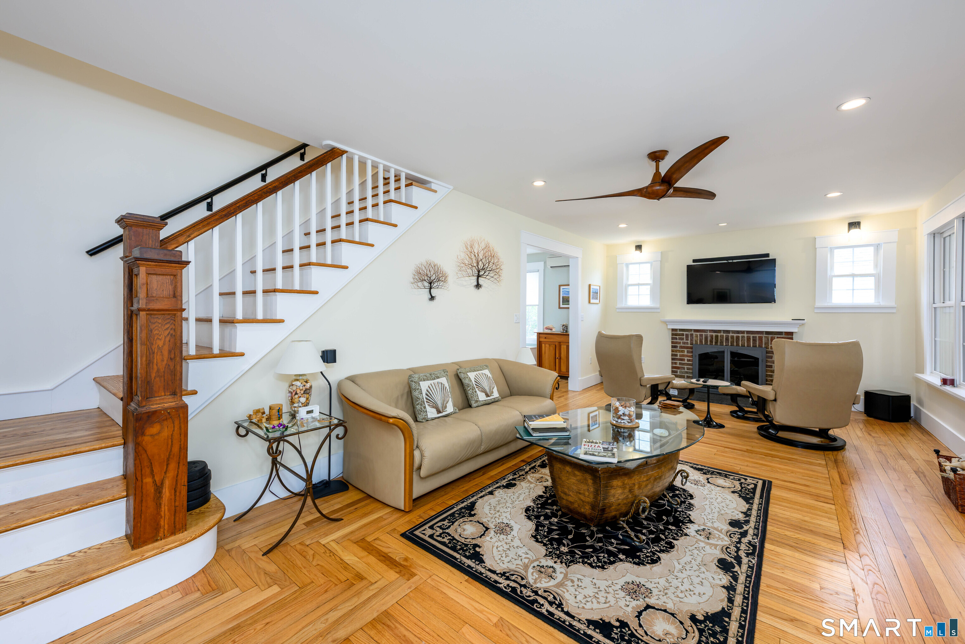 77 Prospect Road East Haven, CT 06512 - Photo 12 of 31 End of living room is stairway to the upper level.