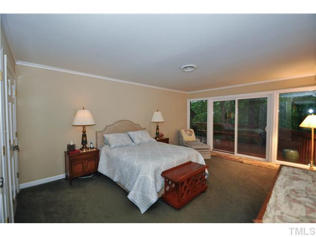 5409 Edington Lane Raleigh, NC 27604 - Photo 13 of 22 Spacious master bedroom with his/her closets and a whole wall of windows with access to the deck Master Bedroom