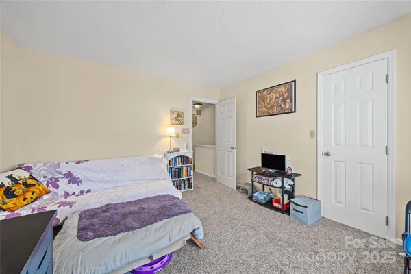 a bedroom with furniture and a bed