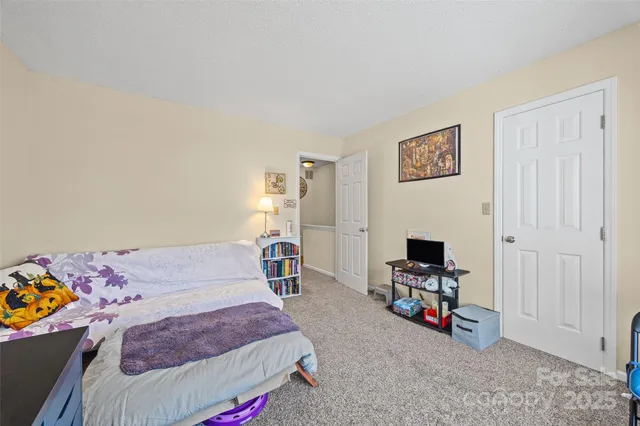 a bedroom with furniture and a bed